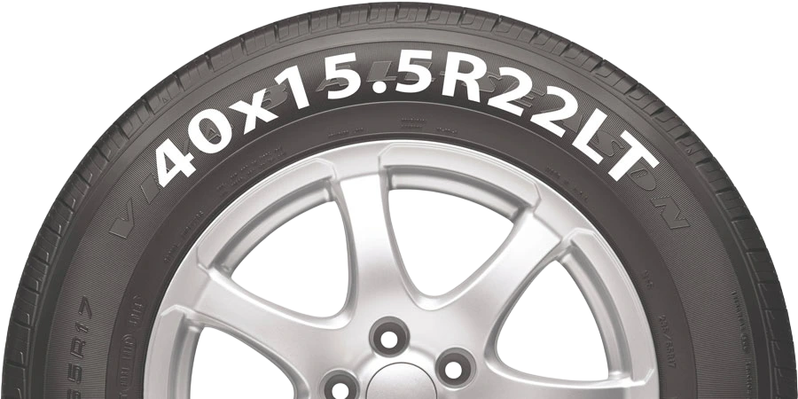 A tire sidewall reading 40x15.5R22LT