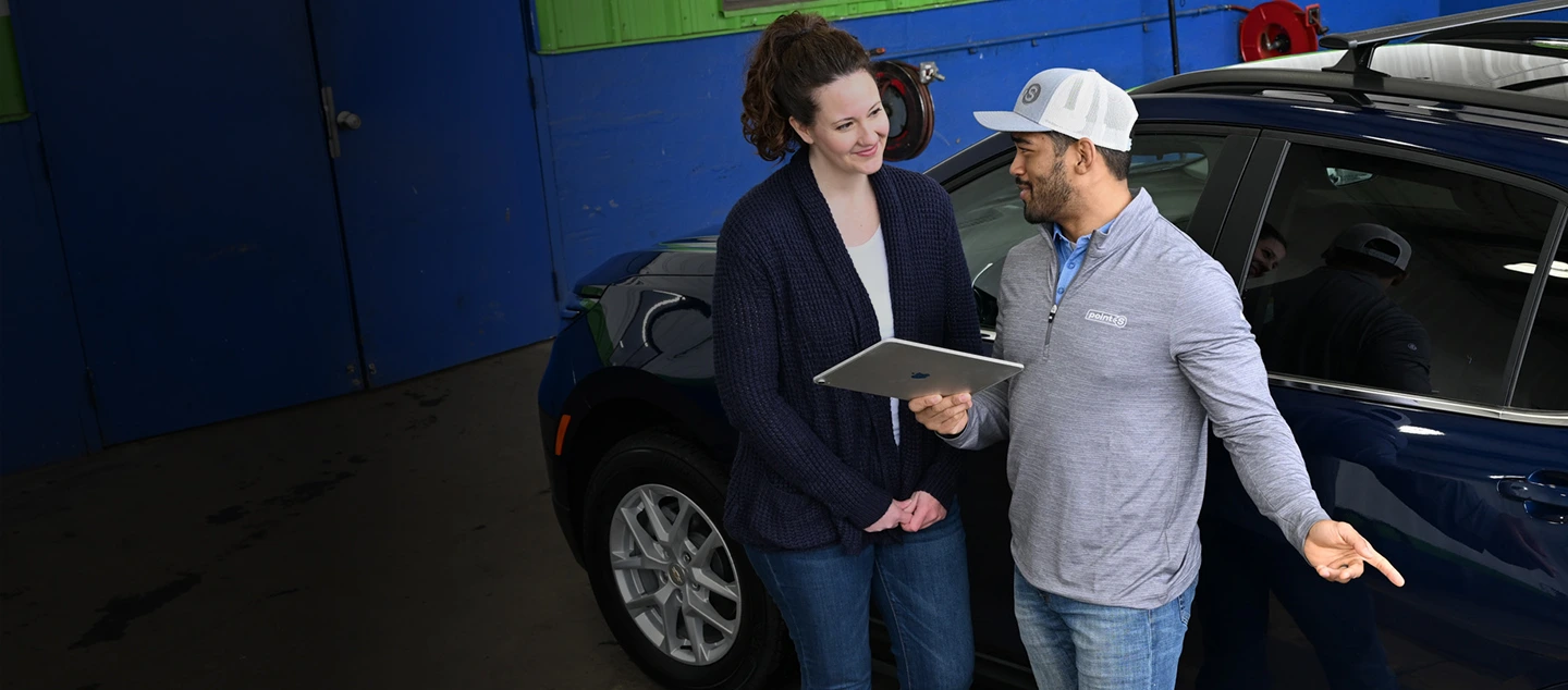 Point S team member explaining financing options to a customer